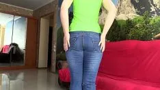 Play A missy with a pleasant bunt tries on fast dungarees and thumbing in them, wet step-ins.